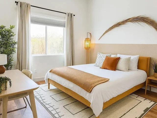 a bedroom with a bed and chair