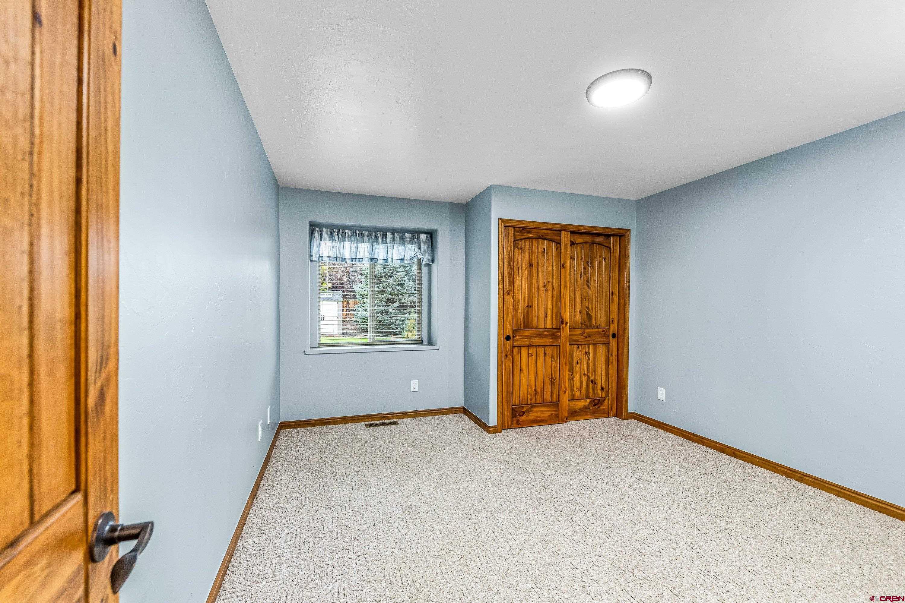 1455 Criterion Street Delta, CO 81416 - Photo 15 of 27 an empty room with windows