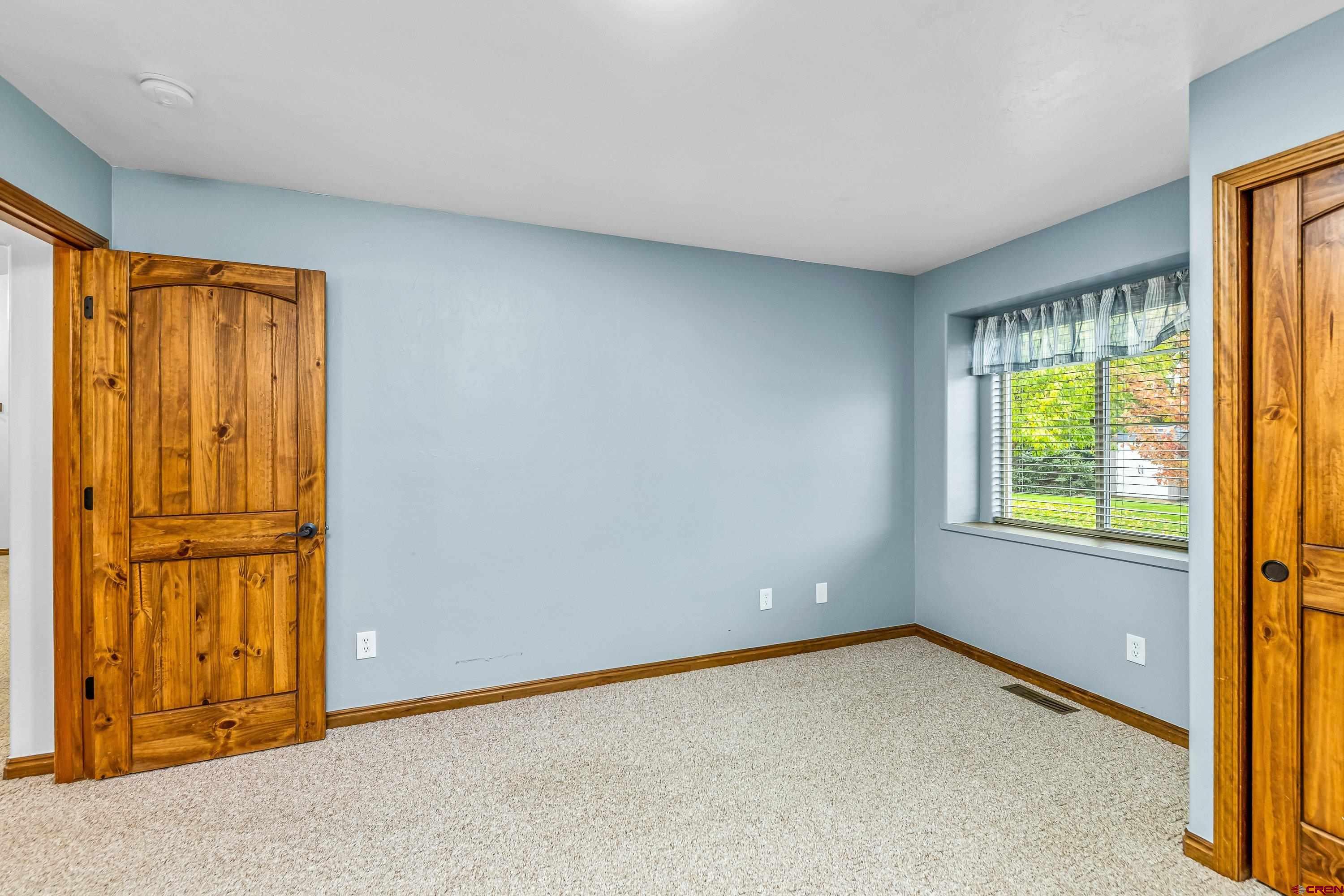 1455 Criterion Street Delta, CO 81416 - Photo 16 of 27 an empty room with windows