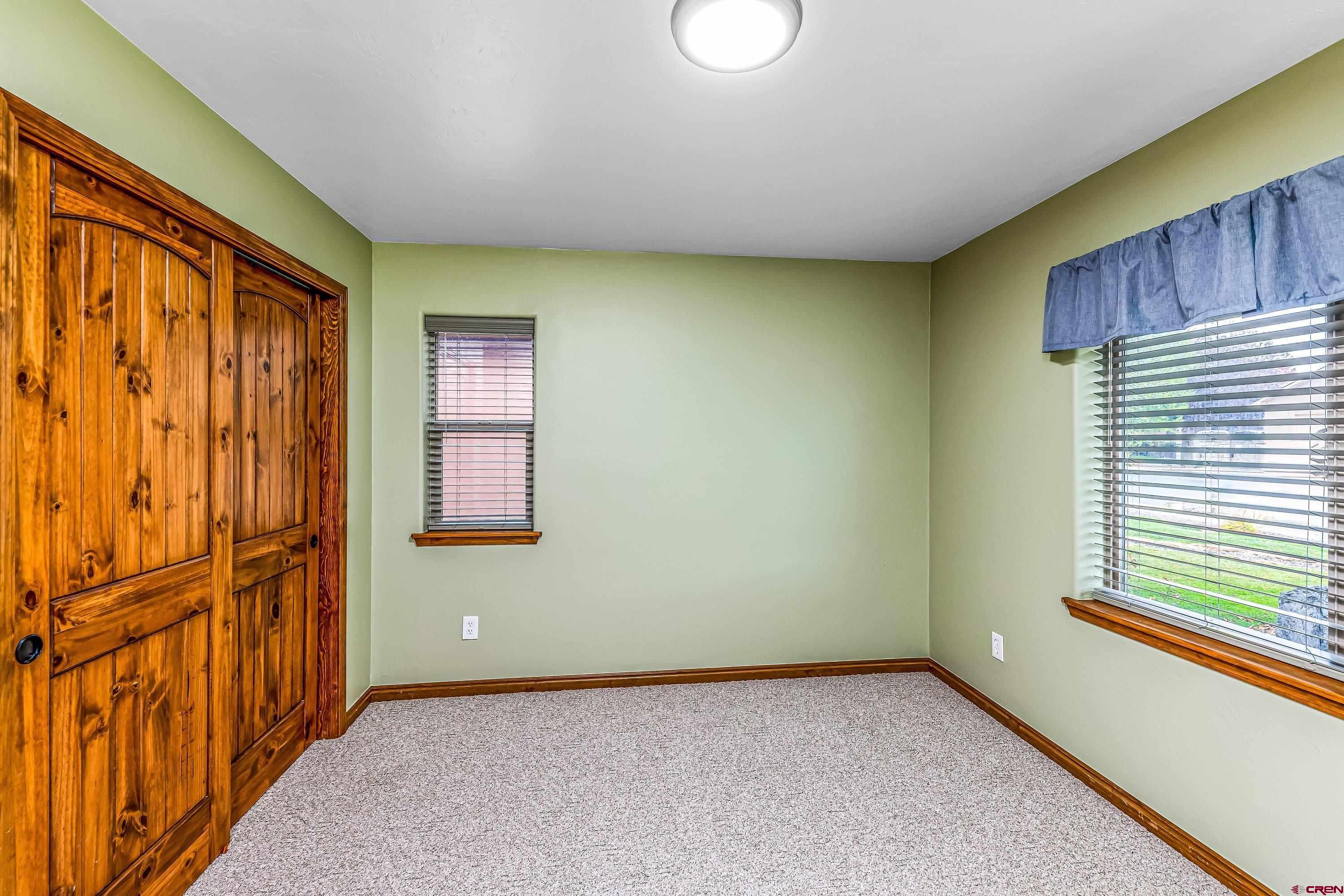 1455 Criterion Street Delta, CO 81416 - Photo 19 of 27 an empty room with windows