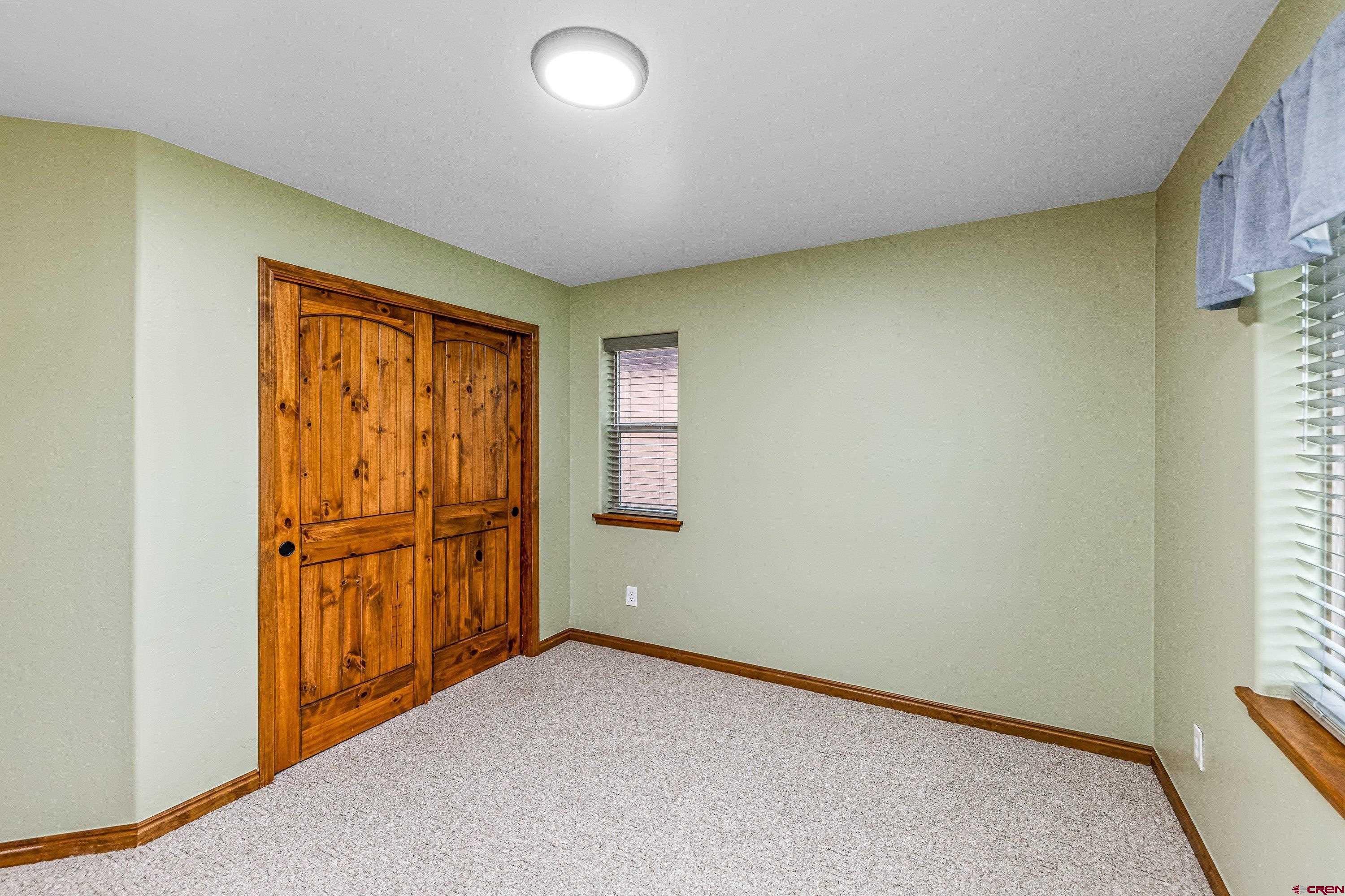 1455 Criterion Street Delta, CO 81416 - Photo 20 of 27 an empty room with windows