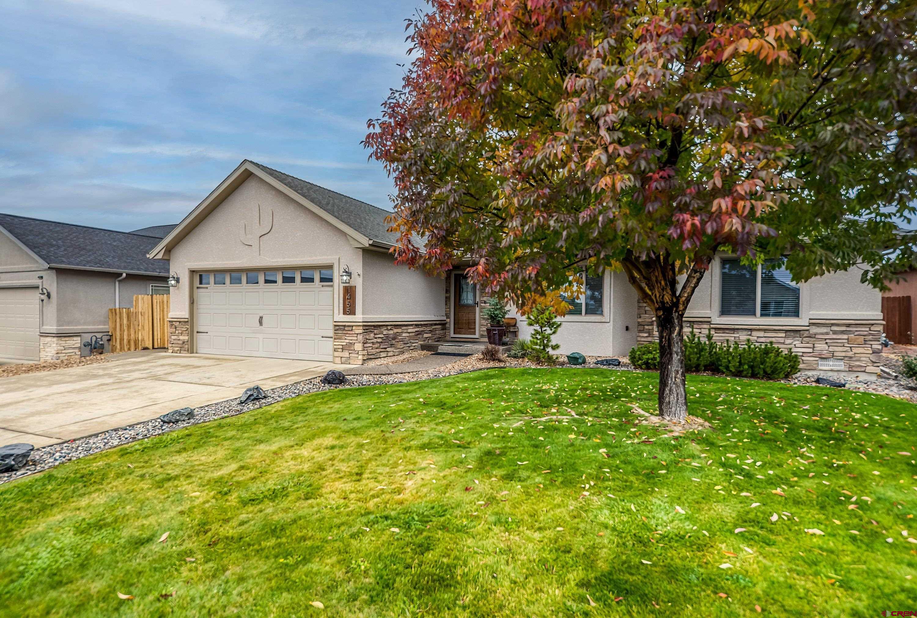 1455 Criterion Street Delta, CO 81416 - Photo 2 of 27 a front view of a house with yard and green space