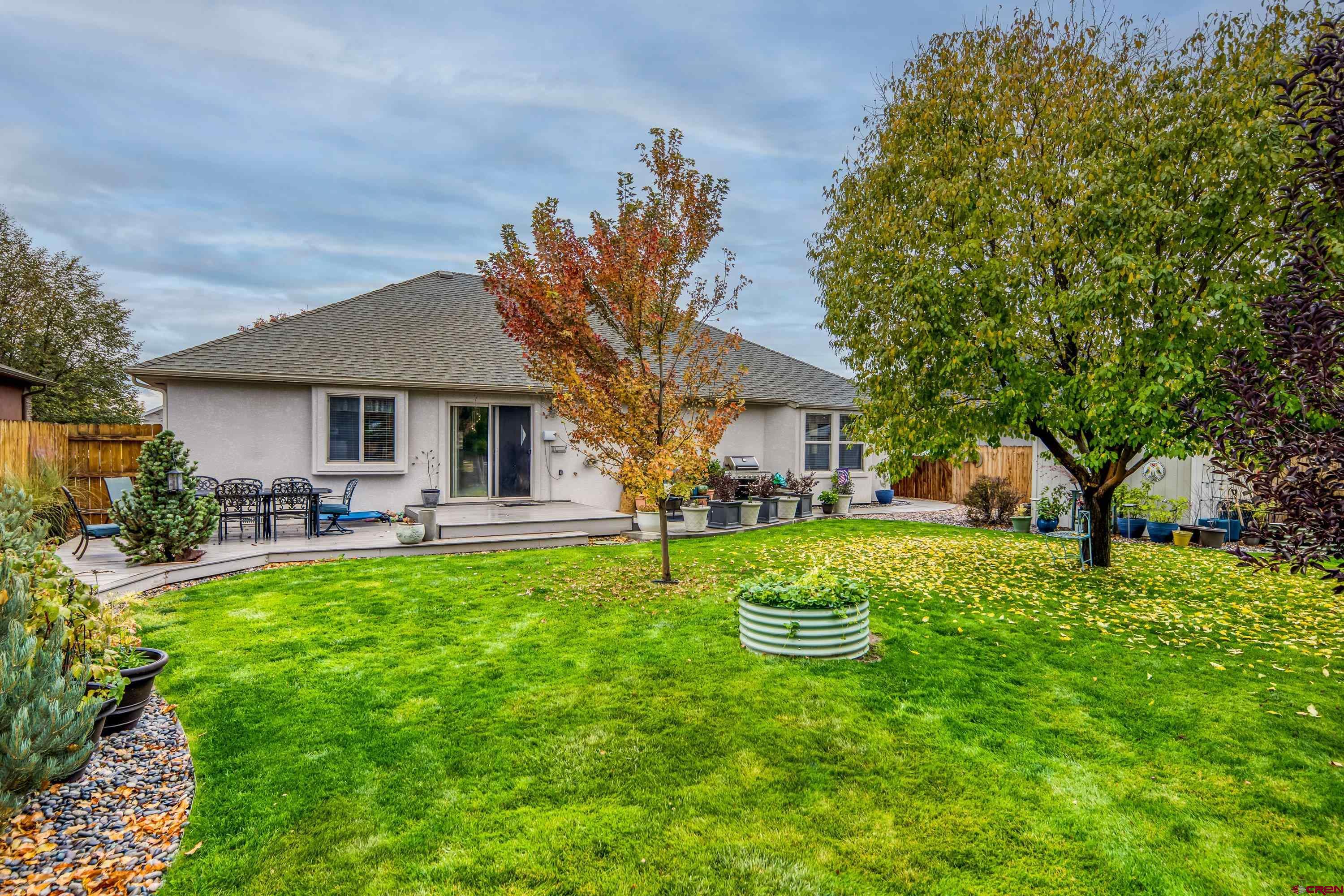 1455 Criterion Street Delta, CO 81416 - Photo 23 of 27 a view of a house with backyard and sitting area