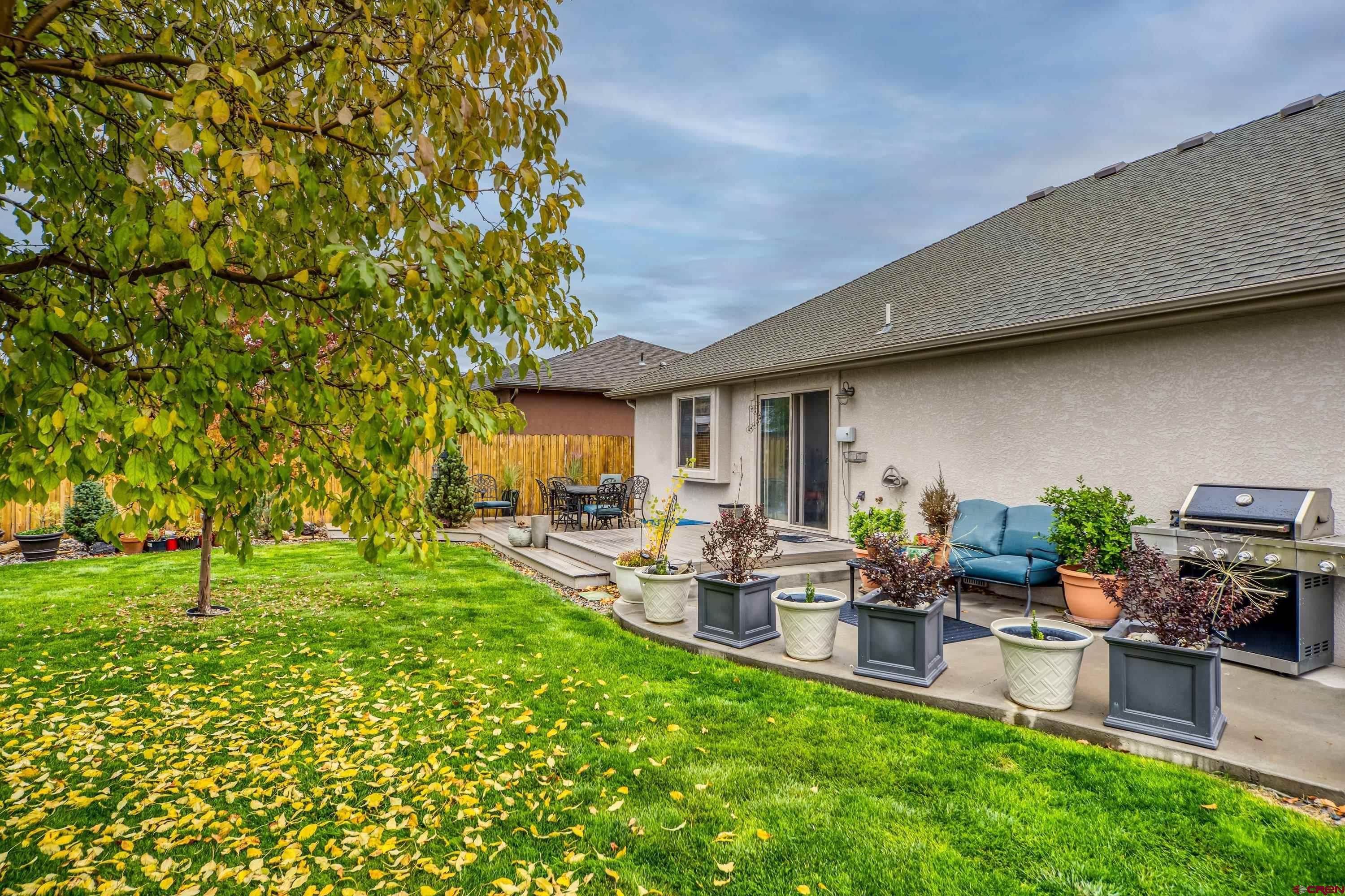 1455 Criterion Street Delta, CO 81416 - Photo 24 of 27 a living room with furniture and a garden