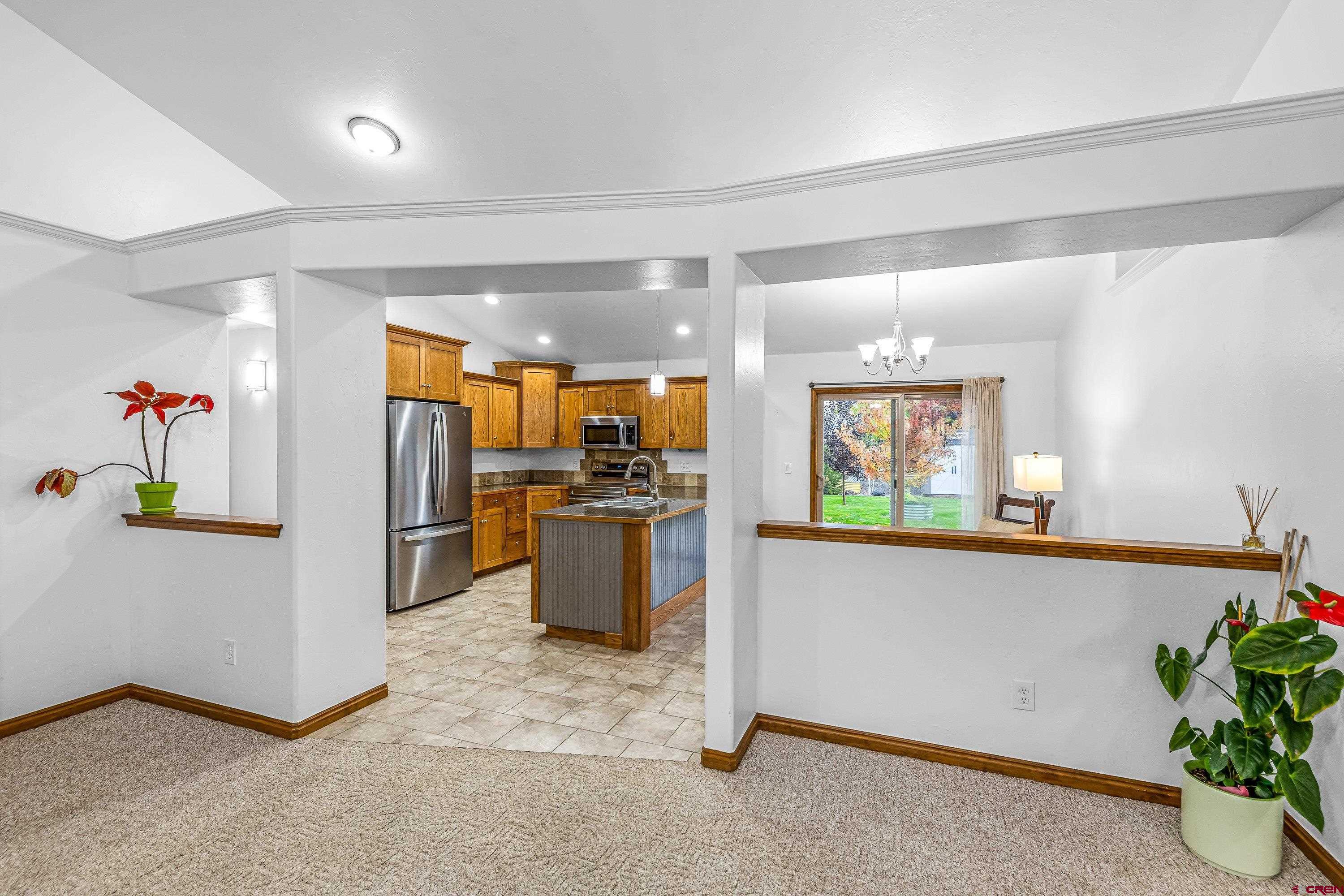 1455 Criterion Street Delta, CO 81416 - Photo 6 of 27 a view of kitchen with furniture and refrigerator