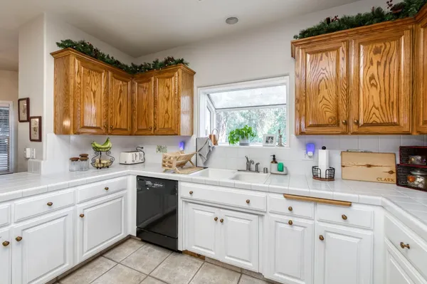 a large kitchen with a large window
