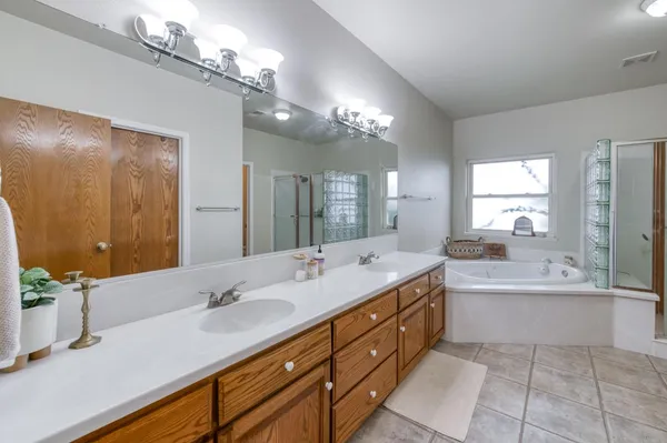 a bathroom with a tub and a shower
