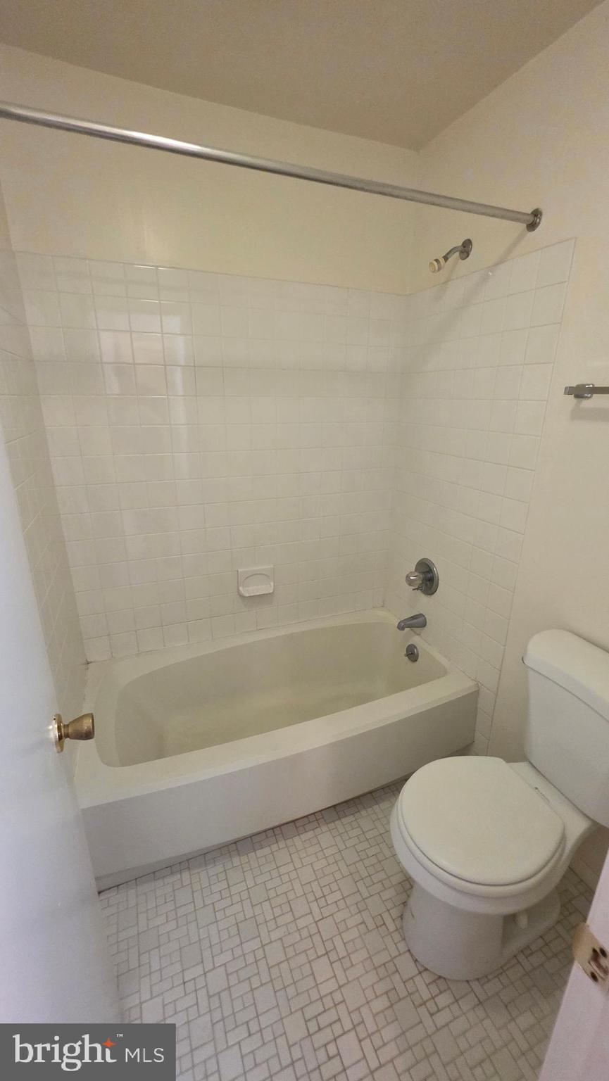3928 Rolling Rd., Unit C10 Pikesville, MD 21208 - Photo 14 of 26 a bathroom with a toilet and a shower