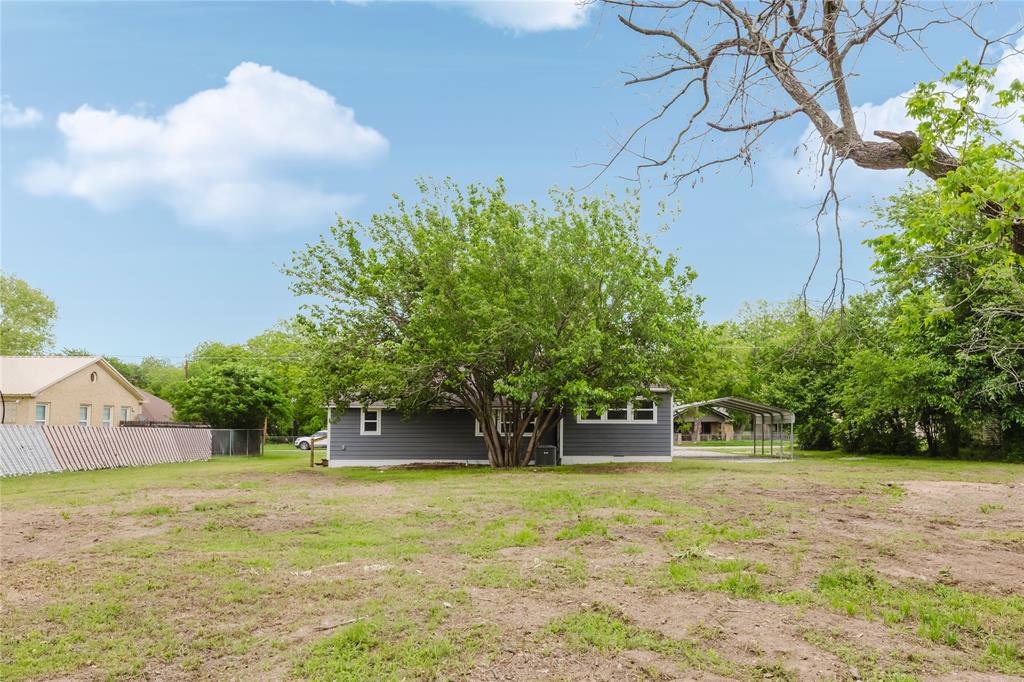524 West Roberts Street Gorman, TX 76454 - Photo 33 of 35 a front view of a house with a yard