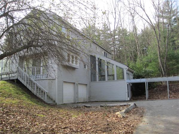 1018 Liberty Square Road Boxborough, MA 01719 - Photo 1 of 22 a view of a house with a yard