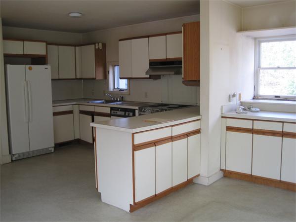 1018 Liberty Square Road Boxborough, MA 01719 - Photo 6 of 22 a kitchen with appliances a sink and cabinets