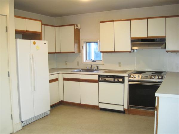 1018 Liberty Square Road Boxborough, MA 01719 - Photo 7 of 22 a kitchen with stainless steel appliances granite countertop white cabinets and a refrigerator