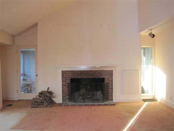 1018 Liberty Square Road Boxborough, MA 01719 - Photo 10 of 22 a living room with furniture and a fireplace