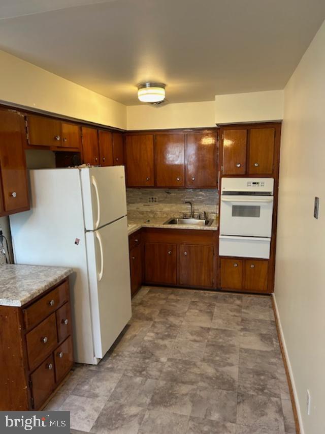 10120 Verree Road Philadelphia, PA 19116 - Photo 14 of 17 a kitchen with stainless steel appliances a refrigerator and a stove