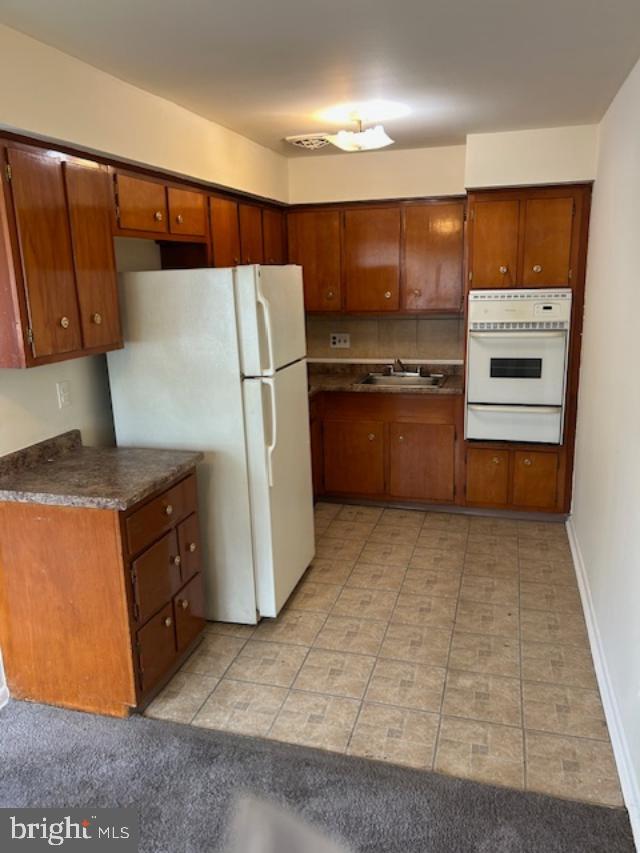 10120 Verree Road Philadelphia, PA 19116 - Photo 5 of 17 a kitchen with stainless steel appliances a refrigerator and a stove