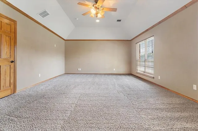a bedroom with a bed and cabinet