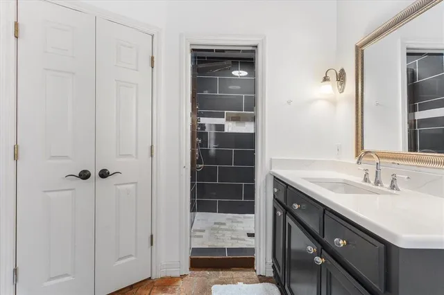 a bathroom with a sink and a mirror