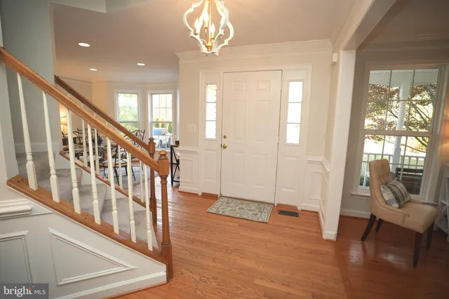 a view of an entryway with wooden floor