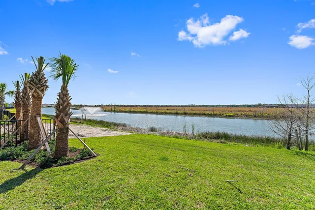 an empty room with cabinet and mirrors