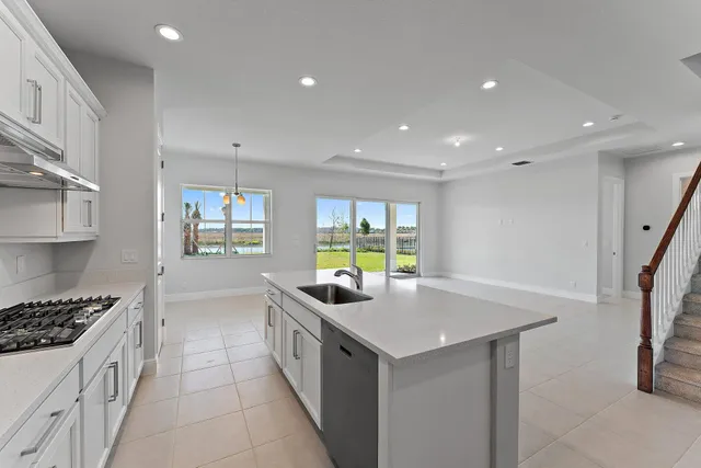 an empty room with windows and entrance