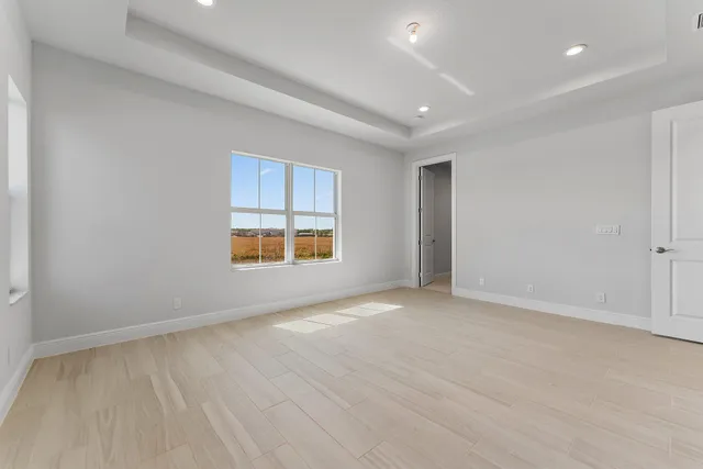 an empty room with a ceiling fan and a ceiling fan
