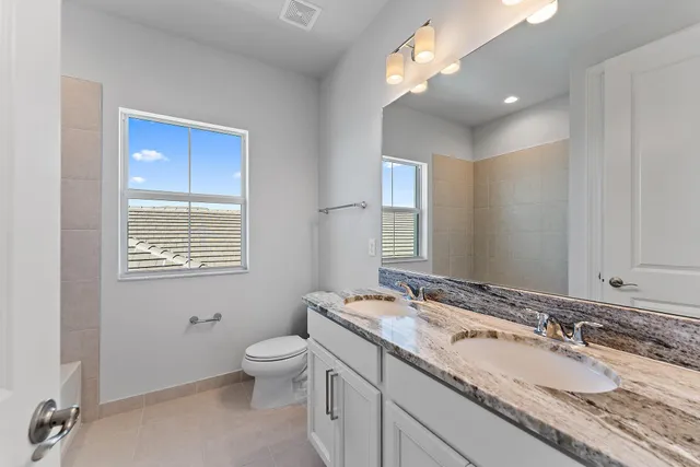 an aerial view of a house with a garden