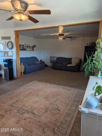 a view of room with furniture and a potted plant