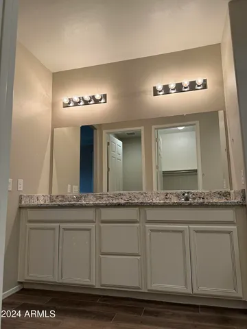 a bathroom with a sink and mirror