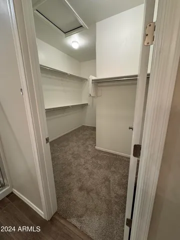 a view of an empty walk in closet