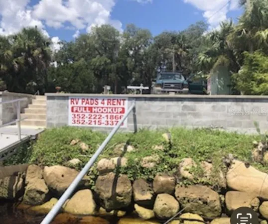 a view of swimming pool with a patio