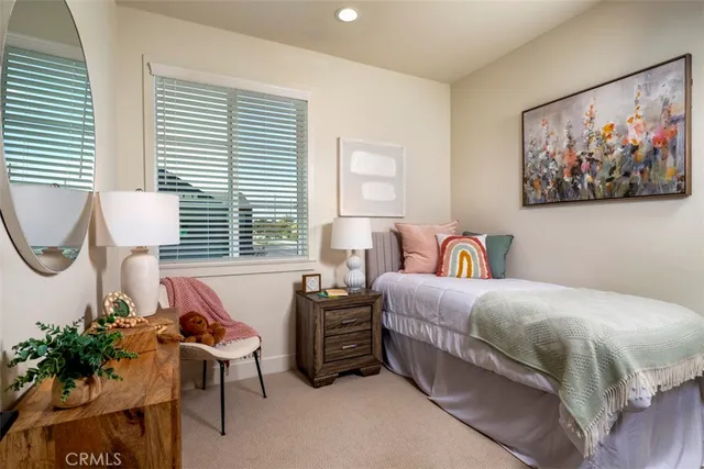 a bedroom with bed and a window