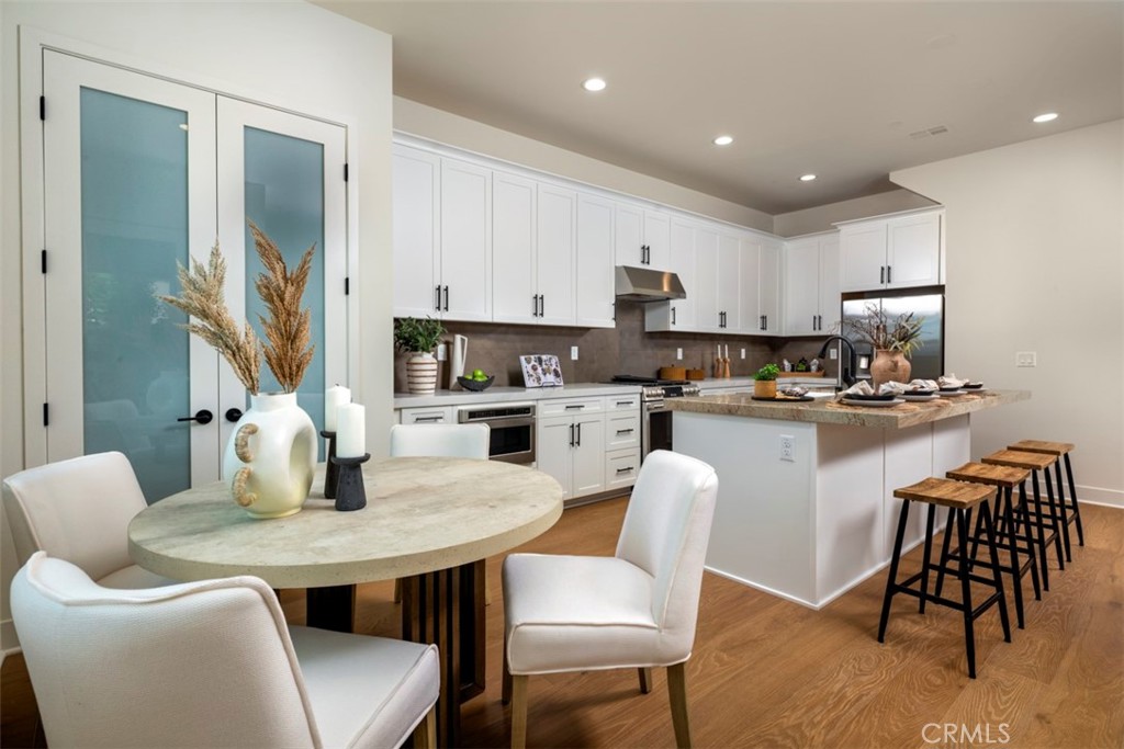 18016 Roch Court Fountain Valley, CA 92708 - Photo 5 of 22 model home interior- kitchen & dining