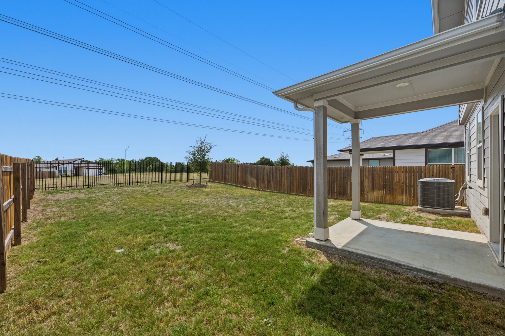 7511 Traylor Cove Austin, TX 78724 - Photo 30 of 40 a backyard of a house with table and chairs