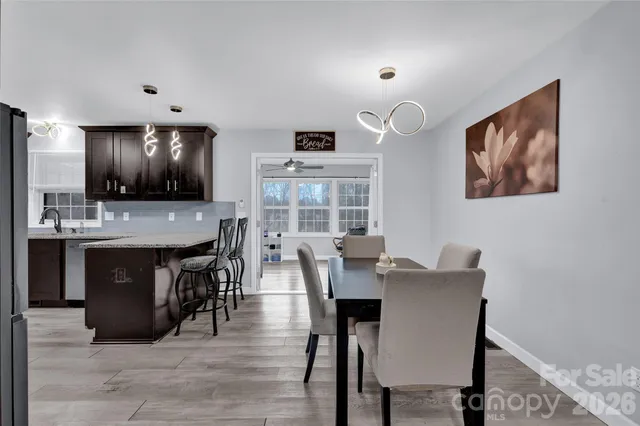 a view of a livingroom with workspace and a window