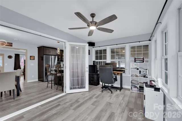 a bedroom with furniture and a flat screen tv