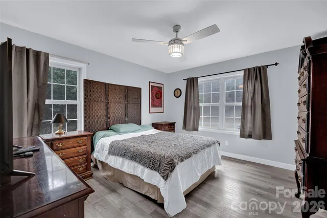 a bedroom with a bed and a television