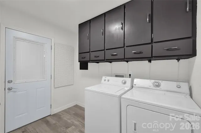 a roof deck with table and chairs and a fire pit