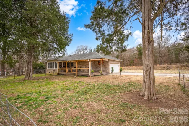 a kitchen with stainless steel appliances granite countertop wooden cabinets a stove top oven a sink and dishwasher