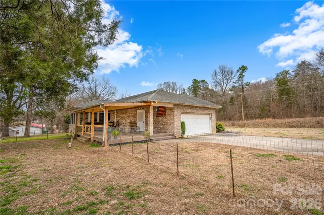a kitchen with stainless steel appliances granite countertop wooden cabinets a oven and granite counter tops