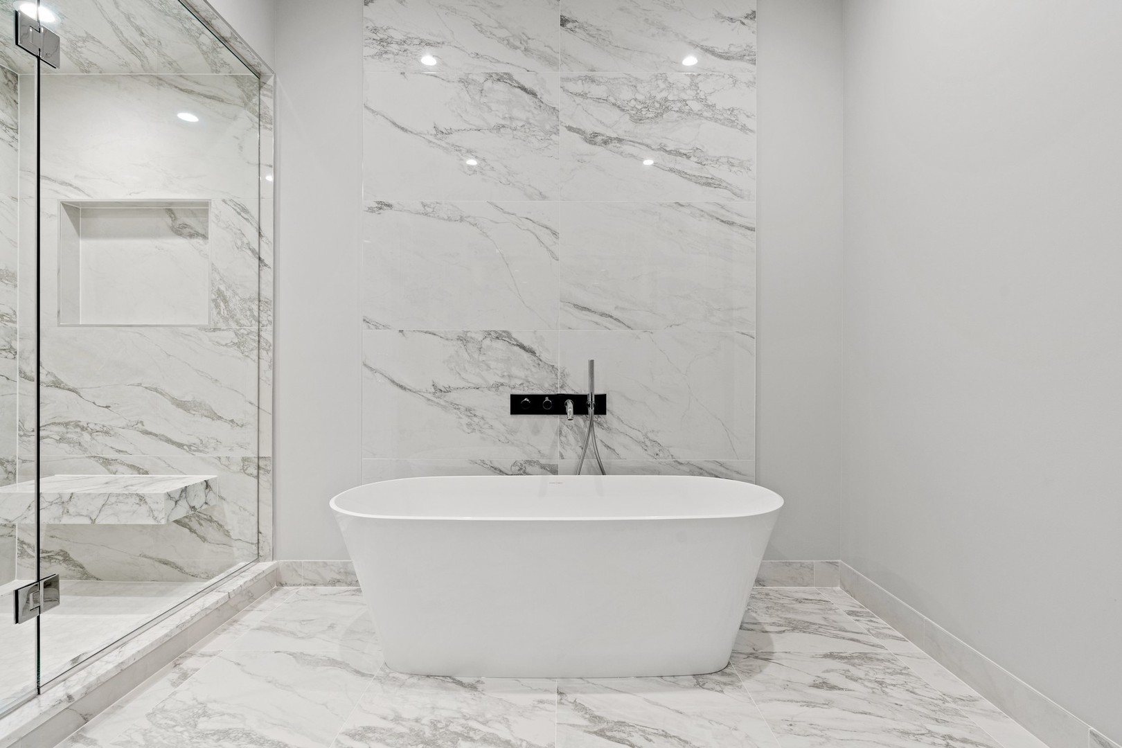 236 South Green Street, Unit 2S Chicago, IL 60607 - Photo 11 of 15 a white bath tub sitting in a bathroom and shower