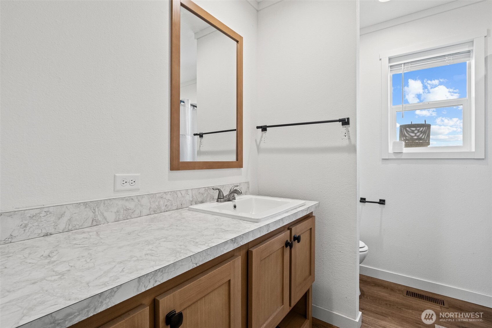 910 Canyon Trail Ephrata, WA 98823 - Photo 21 of 30 a bathroom with a sink and a mirror