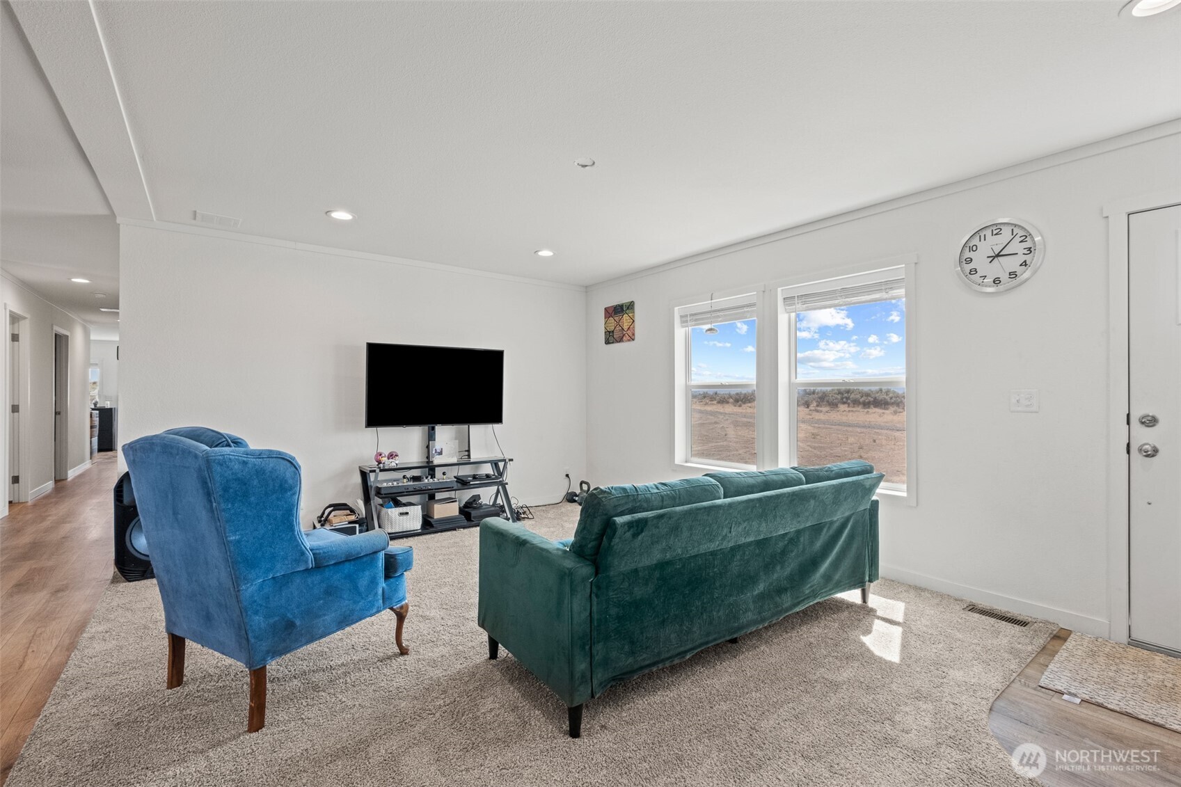 910 Canyon Trail Ephrata, WA 98823 - Photo 6 of 30 a living room with furniture and a flat screen tv
