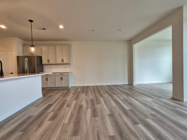 a view of kitchen with wooden floor and window