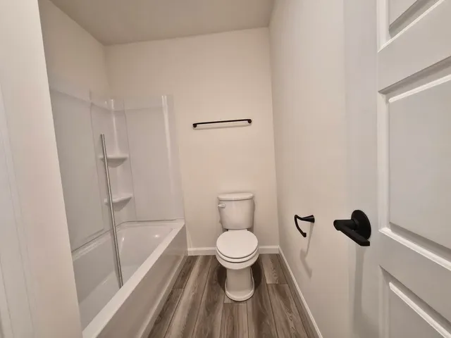 a view of a hallway view with mirror and window