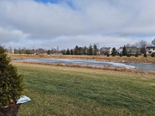 a view of a lake with a yard