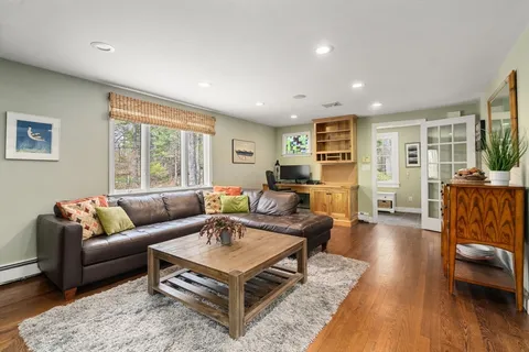 a living room with furniture and a table