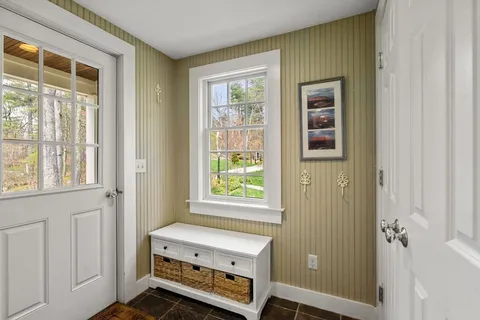 a room with a window and bed