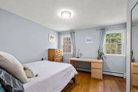 a bed room with a bed and a window