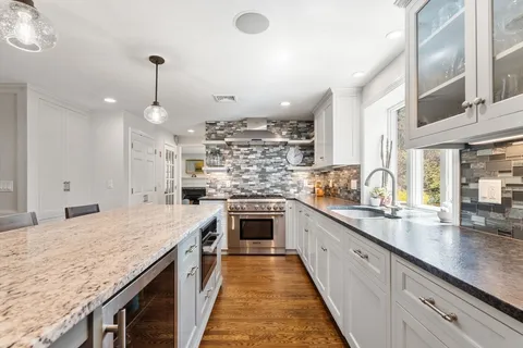 a kitchen with kitchen island granite countertop lots of counter top space
