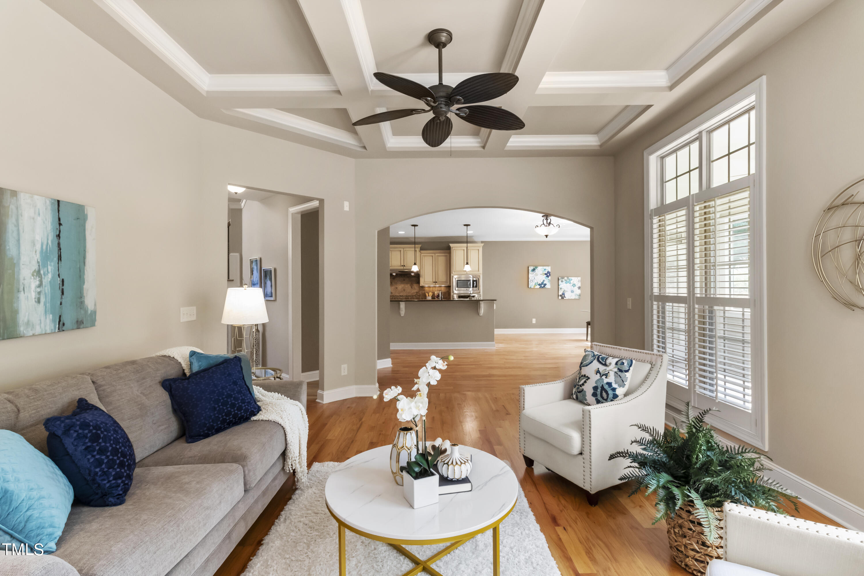 6507 Glendower Road Raleigh, NC 27613 - Photo 12 of 42 a living room with furniture a chandelier and a table